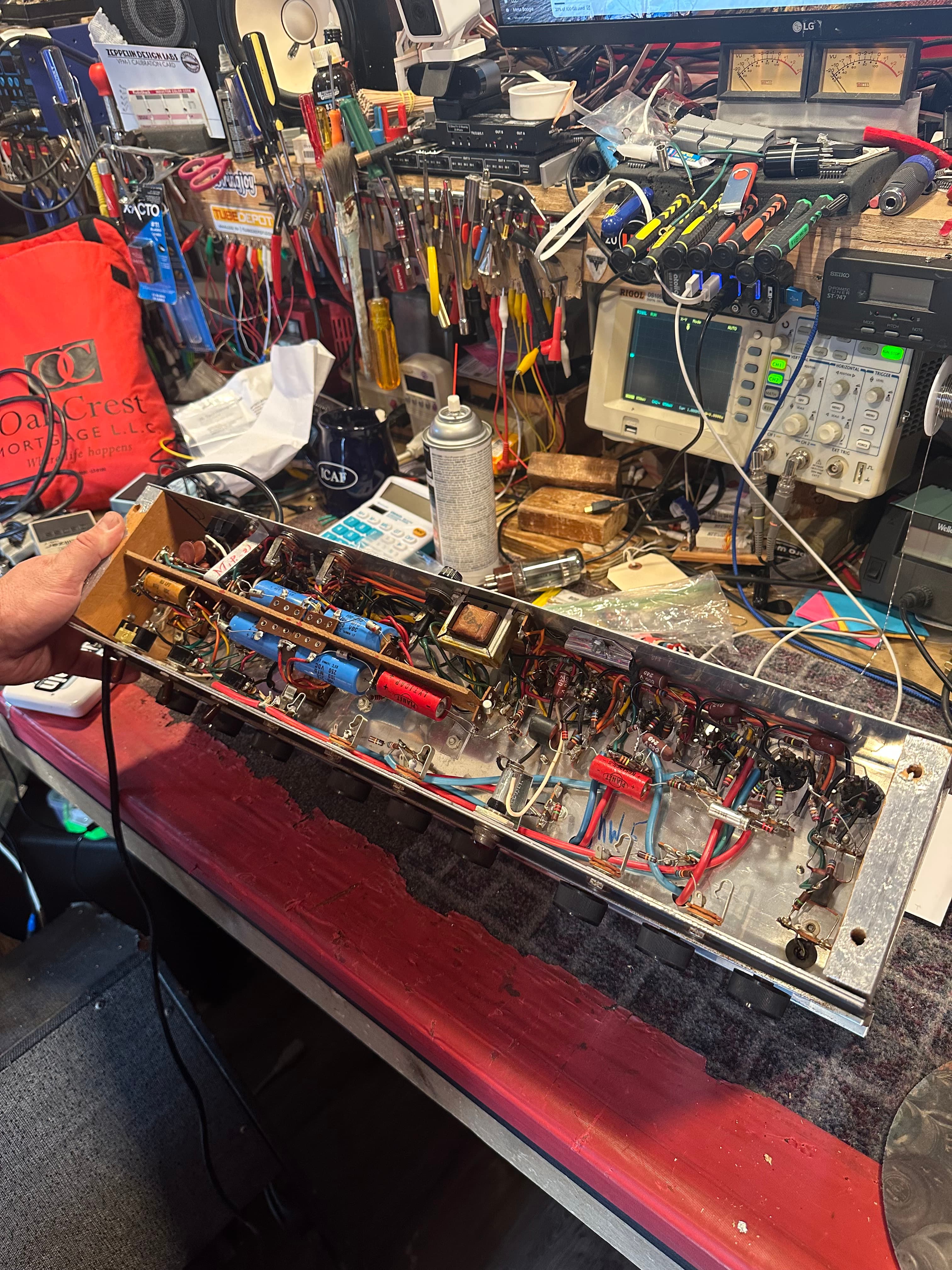 Silvertone 1485 chassis on the bench with oscilloscope