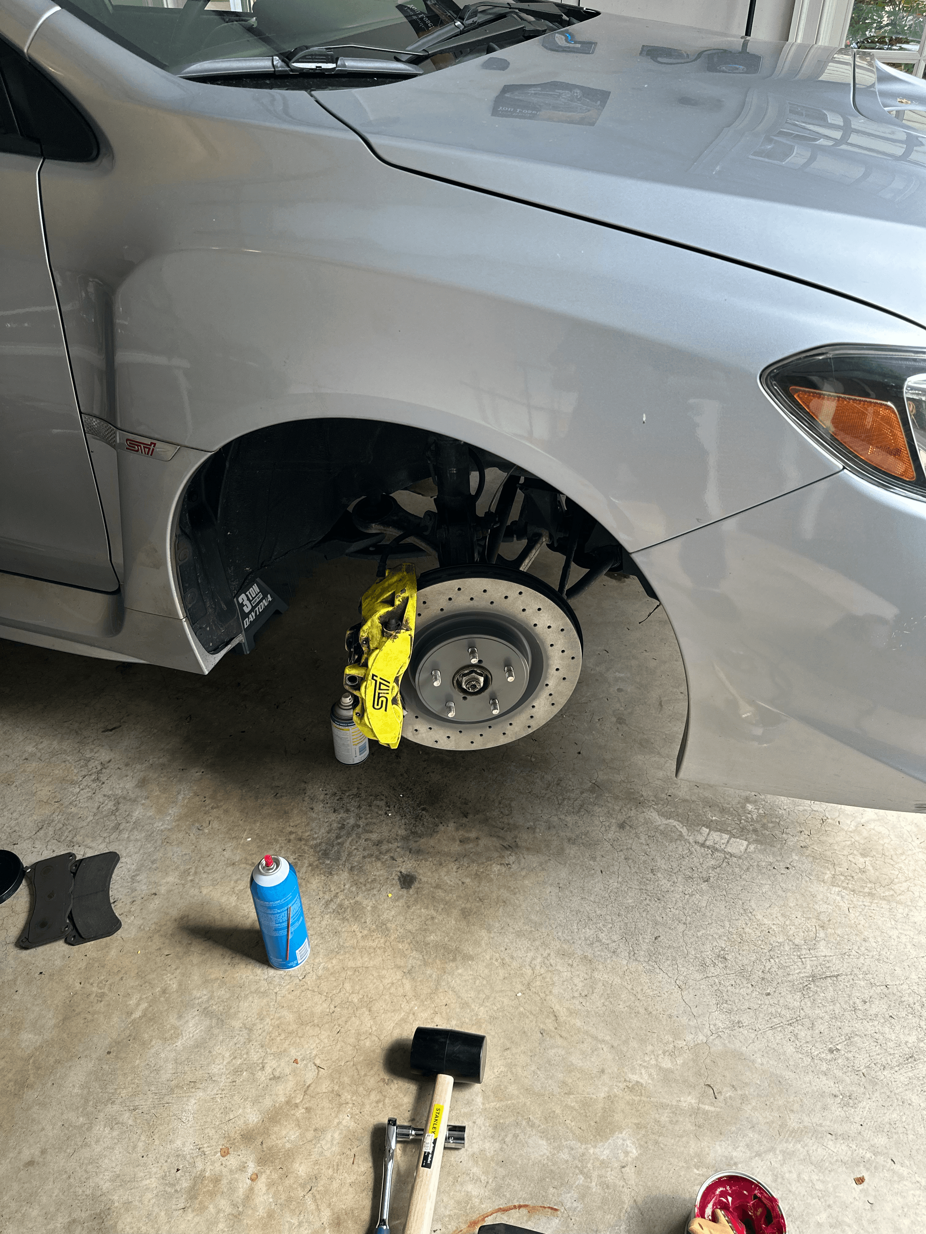 STI front brake upgrade with yellow caliper