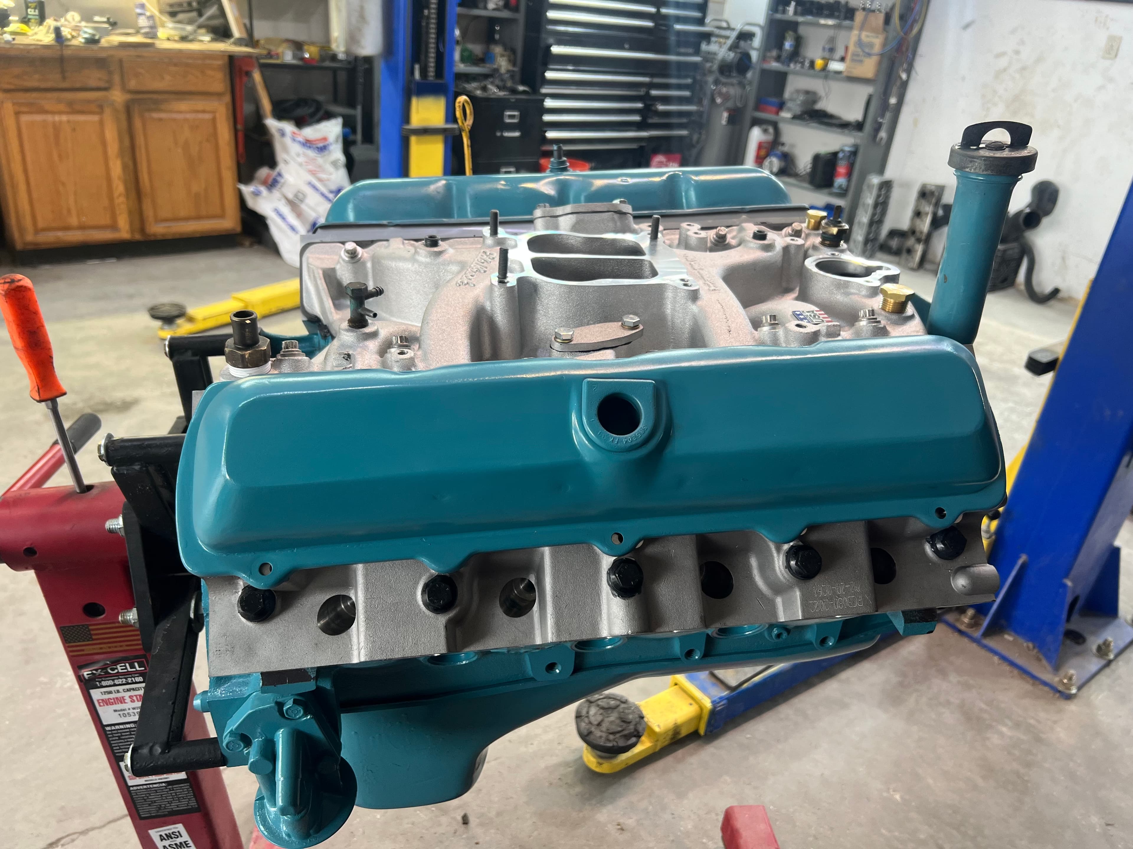 Rebuilt Pontiac V8 with teal valve covers
